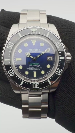 Blue Seiko Deep Sea mod automatic dive watch with black bezel and stainless steel bracelet