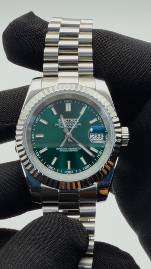 Green sunburst Seiko Datejust mod automatic watch with fluted bezel and stainless steel bracelet