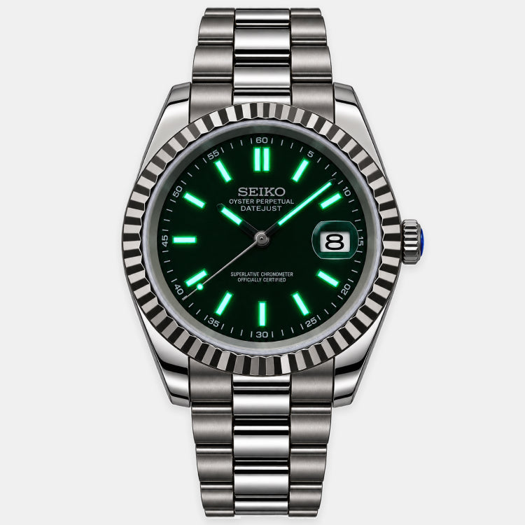 A Seiko stainless steel watch with a dark green dial, bright green luminescent markers, and a fluted bezel, shown on a light gray background.