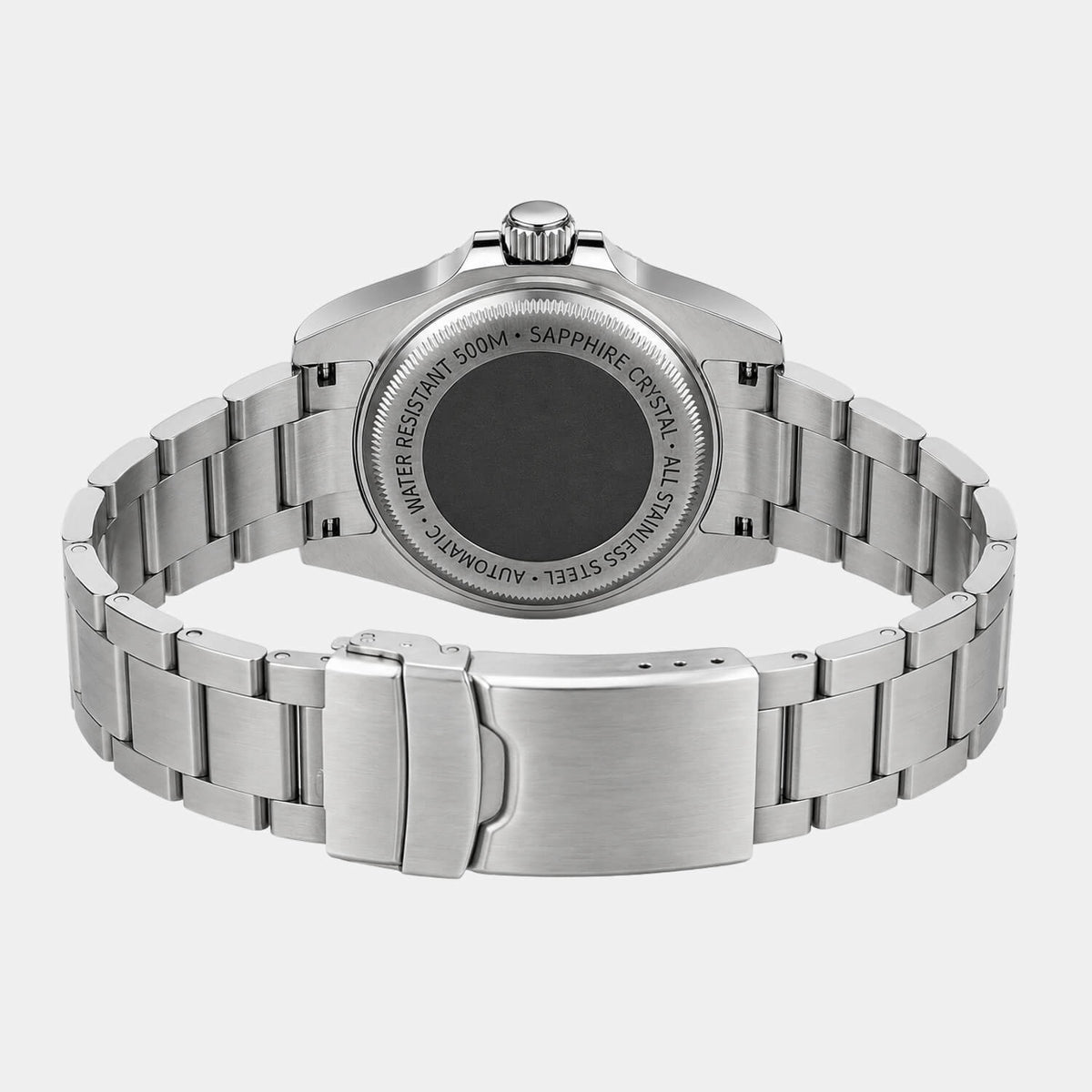 The back view of a stainless steel wrist watch with a metal link bracelet, showing the brushed and polished surfaces, crown, and engraved case details on a light gray background.